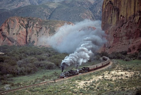 South African Railways 24-class steam locomotive nos. 3603 and 3684 lead northbound passenger train at Barandas, Cape Province (present-day Western Cape), South Africa, on July 24, 1995. Photograph by Katherine Botkin. © 1995, Katherine Botkin.