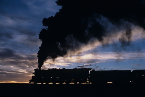 Atchison, Topeka and Santa Fe Railway steam locomotive no. 3751 leads passenger train near Woodin, Arizona, on August 23, 2002. Photograph by William Botkin. © 2002, William Botkin