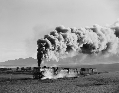 South African Railways 19D-class steam locomotive no. 3321 leads a mixed train near Aston, Cape Province (present-day Western Cape), South Africa, on May 31, 1993. Photograph by William Botkin. © 1993, William Botkin