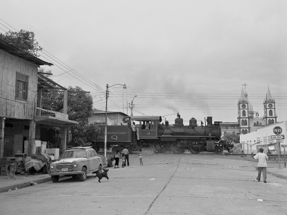 Guayaquil and Quito Railway steam locomotive no. 11 leads passenger train through Yaguchi, Guayas, Ecuador, on August 16, 2003. Photograph by William Botkin. © 2003, William Botkin