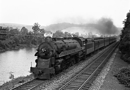 Lehigh Valley Railroad K-3 4-6-2 steam locomotive 2023 with passenger train no. 25, the "Asa Packer," running west along the Lehigh River south of Slatington, Pennsylvania, on October 8, 1940. The train's namesake was the father of the railroad and founder of Lehigh University in Bethlehem, Pennsylvania. Photograph by Donald W. Furler, Furler-03-088-03, © 2017, Center for Railroad Photography and Art