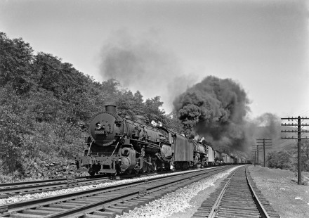Lehigh Valley Railroad steam locomotives 4026 and 5219, an R-1 2-10-2 and T-2b 4-8-4, pull a 57-car freight train west between Mauch Chunk and Coalport, Pennsylvania, on May 30, 1947. The 4026 was probably a headend helper added at Lehighton for the trip up the mountain. Photographed by Donald W. Furler, Furler-22-057-01, © 2017, Center for Railroad Photography and Art