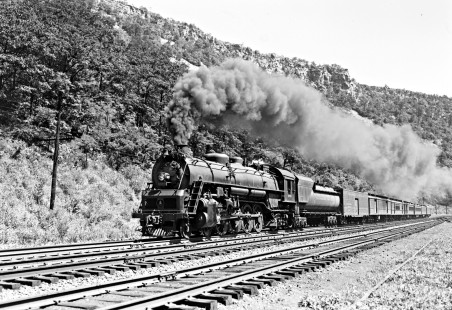 Baltimore and Ohio Railroad 4-8-2 steam locomotive no. 5579 leading seven-car passenger train no. 21 through The Narrows of Cumberland, Maryland, on August 23, 1952. Photograph by Donald W. Furler, Furler-13-101-01, © 2017, Center for Railroad Photography and Art