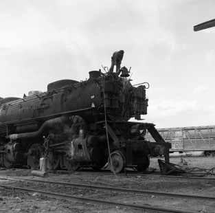 National Railways of Mexico steam locomotive no. 2032 getting work done in the scrap yard at Aguascalientes, Mexico, on August 16, 1962. Photograph by Victor Hand, Hand-NdeM-X129-0975.JPG