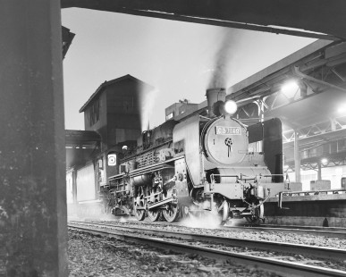 Japanese National Railways steam locomotive no. C57-149 at 9:19 PM running from Sapporo to Otaru on Hakodate main line at Sapporo, Iburi, Japan, on June 7, 1966. Photograph by Victor Hand, Hand-JNR-10-016.JPG