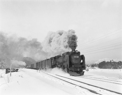Japanese National Railways steam locomotive no. D51-1108 with diesel pusher no. D51-1095 leading freight South on Ōu main line at Ikarigaseki, Aomori, Japan, on January 14, 1971. Photograph by Victor Hand, Hand-JNR-18-010.JPG