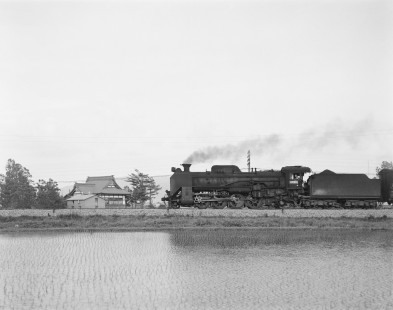 Japanese National Railways steam locomotive no. D51-561 hauling freight North at Moseushi, Sorachi, Japan, on June 10, 1966. Photograph by Victor Hand, Hand-JNR-10-050.JPG
