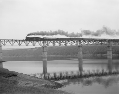 Soviet Railways steam locomotive FD-2714 pulling a passenger excursion train running north from Larga to Grechany crossing the Dniester River in Ukraine on September 29, 1994. Photograph by Victor Hand, Hand-SZD-260-173