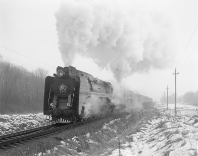 Soviet Railways steam locomotives P36-0218 and P36-050 lead a northbound excursion train running from Zitomir to Korosten at Strokovitzy, Ukraine, on February 25, 1994. Photograph by Victor Hand, Hand-SZD-260-086