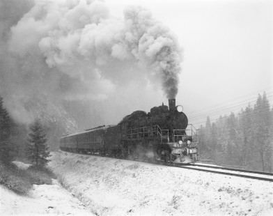 Soviet Railways steam locomotive SU251-86 leading a southbound passenger excursion train from Ivano Frankovsk to Rachov through the snow at Vorohta, Ukraine, on December 10, 1992. Photograph by Victor Hand, Hand-SZD-254-293
