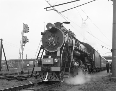 Soviet Railways steam locomotive L-0312 leading an eastbound passenger train from Riga to Valmiera at Riga Oschkalny, Republic of Latvia, on June 6, 1990. Photograph by Victor Hand, Hand-PKP-SZD-VR-251-114