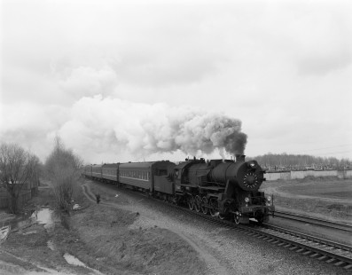 Soviet Railways steam locomotive TE 6365 leading an eastbound passenger excursion train from Osipovichi arriving at Mogilev, Republic of Belarus, on April 18, 1992. Photogrpah by Victor Hand, Hand-SZD-254-151
