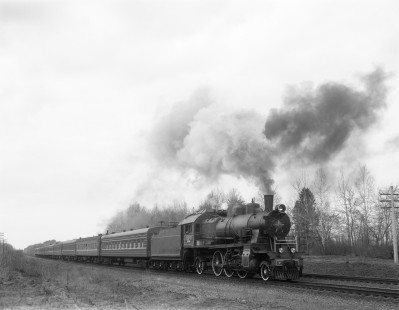 Soviet Railways steam locomotive SU 253-33 leading an eastbound excursion train from Osipovichi to Zhlobin at Krasnyi Bereg, Republic of Belarus, on April 15, 1992. Hand-SZD-254-093