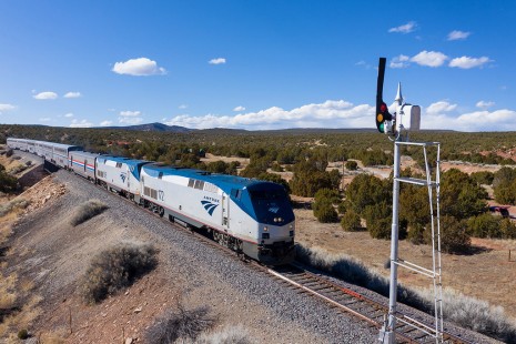 Highball signal for Amtrak’s Southwest Chief, Train 4, as the 7-car train passed ATSF T-2 style semaphore at West Siding Switch Chapelle, New Mexico, on March 2, 2020.  BNSF’s Glorieta Pass Subdivision. © Chip Sherman
