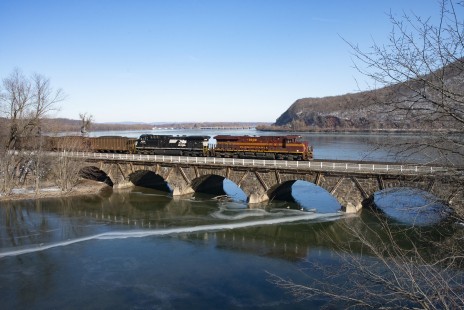 Norfolk Southern Train 776, an eastbound coal movement with Engs. 8102 (Pennsylvania Railroad heritage unit) and 4226 and DPU helpers on rear 8036-3678 crosses Sherman's Creek Bridge, Duncannon, Pennsylvania, on the NS Pittsburgh Line. © Dan Cupper