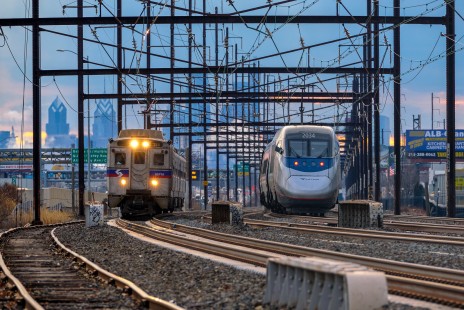 As a SEPTA Regional Rail train heads north out of Philadelphia, Pennsylvania, Amtrak train 2253 runs at track speed south towards a station stop at 30th Street Station, on January 26, 2020. © John Regan