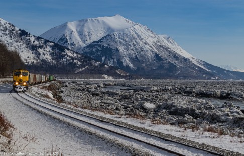 An Alaska Railroad freight hugs the shores of Turnagain Arm as they make their way north towards Anchorage on a bitterly cold but sunny winter's day, on March 13, 2020. © Frank Keller