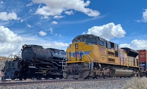 Celebrating the 150th Anniversary of the Golden Spike, Union Pacific restored Big Boy #4014. The locomotive was captured at Point of Rocks, Wyoming on its westbound run from Cheyenne to Ogden as an eastbound doublestack passed. © John Behrens