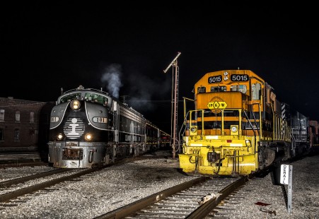 During a frigid December 22, 2018 evening the Indiana Transportation Museum's Polar Bear Express, pulled by leased EMD E8 SLRG 101, starts the last run of the Christmas Holiday season with a load full of children excited to see Santa Claus. The train is crossing the North Crossing diamond, located in Kokomo, Indiana, which previously hosted the NKP and Pennsylvania Railroads passenger trains in days past, guarded by the ancient tilt board signal. © John Troxler