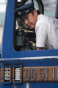 The engineer of JR Hokkaido's Hokutosei overnight train for Tokyo prepares to pull out of Sapporo station on June 20, 2007. Like engineers around the world, he looks at the ground to watch for movement to ensure a smooth start to his train. © Scott Lothes
