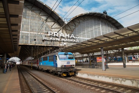 A cathedral to rail transportation, Prague Main Station passengers’ board cross-country and Europe trains beneath a vaulted stained glass train shed, in 2013. © Todd Halamka