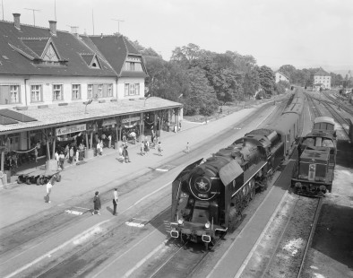 Passengers at the open air Uherský Brod station prepare to board a local passenger train led by Czechoslovak State Railway (CSD) steam locomotive no. 475-194 in Uhersky Brod, Zlín, Czech Republic, on May 22, 1971. Photograph by Victor Hand, Hand-DB-OBB-CSD-GKB-20-187