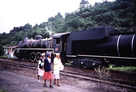 Three women walk along the tracks near South African Railway (SAR) steam locomotive no. 2683 getting ready to leave Rondevlei, Western Cape, South Africa, on March 23, 1995. Photograph by Fred Springer. © 2020, Center for Railroad Photography and Art, Springer-So.Africa(1)-16-25