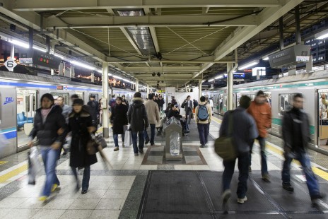 Evening commuters hurry along a platform in Tokyo's Shinjuku Station on January 6, 2007. Handling some two million daily passengers, the staton is the busiest in the world. © Scott Lothes