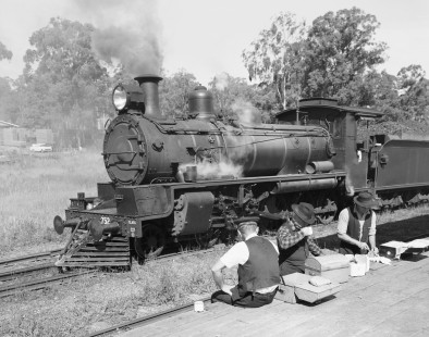 The crew of Queensland Government Railways steam locomotive no. 752 stop in Benarkin, Australia for lunch while pulling a freight train from Yarraman to Ipswich, on May 26, 1967. Photograph by Victor Hand, Hand-NSW-QR-SAR-VR-12-0780