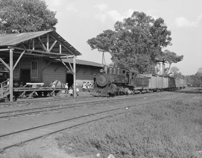 Local residents of Sitio del Niño, El Salvador greet Ferrocarril de El Salvador (FES) steam locomotive no. 12 as it pulls into the station, on February 15, 1974. Photograph by Victor Hand, Hand-FES-FENALdeSAL-24-419