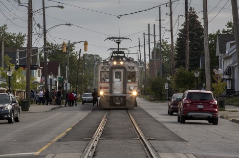 A westbound South Shore passenger train collects passengers in Michigan City, Indiana, where the mainline still runs down main street, in 2017. © Todd Halamka