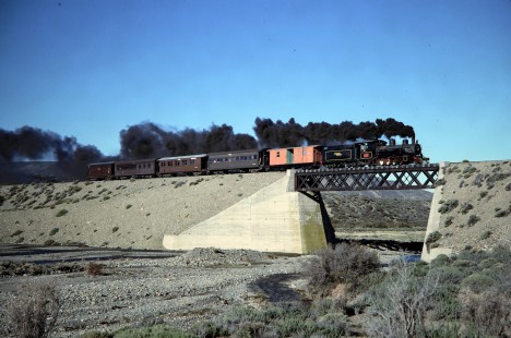 A Viejo Expreso Patagónico (Old Patagonian Express) steam locomotive leads a passenger train over a trestle in Patagonia, Argentina, on October 15, 1990. Photograph by Fred Springer. © 2020, Center for Railroad Photography and Art, Springer-SOAM1-16-31