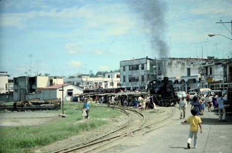 Guayaquil-Quito Railway steam locomotive no. 43 leads a passenger train through downtown Bucay, Chimborazo, Ecuador, on July 9, 1990. Photograph by Fred M. Springer, © 2020, Center for Railroad Photography and Art, Springer-ECU1-22-37