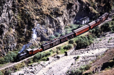 En route to Huigra, Guayaquil-Quito Railway locomotive no. 45 leads passenger train near Alausi, Chimborazo, Ecuador, on July 31, 1988. Photograph by Fred M. Springer, © 2020, Center for Railroad Photography and Art, Springer-ECU1-16-13