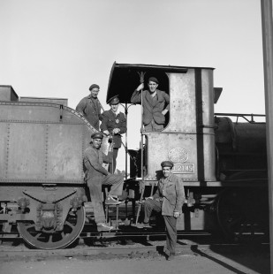 The crew of Renfe Operadora (RENFE) steam locomotive no. 030-2145 poses at a stop in Medina del Campo, Spain, on July 3, 1962. Photograph by Victor Hand, Hand-RENFE-X06-145