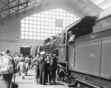 Passengers gather in front of Société nationale des chemins de fer français (SNCF) steam locomotive no. 231-D 767 at a busy Gare du Havre in Le Havre, Seine-Maritime, France, on September 7, 1964. Photograph by Victor Hand, Hand-SNCF-05-619