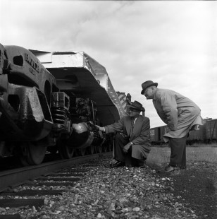 Two men show great interest in the Soo Line's new 300-ton-capacity flatcars in North Fond du Lac, Wisconsin, in October 1961. Photograph by Wallace Abbey. © 2020, Center for Railroad Photography and Art, Abbey-05-037-07