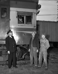 The crew of Atchison, Topeka & Santa Fe Railroad (AT&SF) steam locomotive no. 14 poses after the last run of from Chanute to Kansas City in 1950. Pictured: D. A. Nisbett, conductor; L. J. Whitlow, engineer; J.K. Cooper, brakeman; and J. W. Beeney, expressman. Photograph by Wallace Abbey. © 2020, Center for Railroad Photography and Art, Abbey-03-029-01