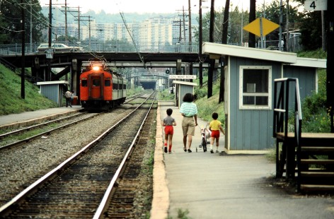 A mother and her two sons walk the length of the train platform at Canadian National Railway (CN) Mont-Royal station in Montreal, Quebec, on August 18, 1986. Photograph by John F. Bjorklund. © 2020, Center for Railroad Photography and Art, Bjorklund-22-05-18