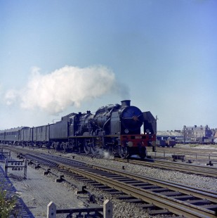 French National Railways steam locomotive no. 231-E37 pulling train  no. 34 running from Calais to Paris at Calais, Pas-de-Calais, France, on July 17, 1962. Photograph by Victor Hand, Hand-SNCF-XC14-28.JPG