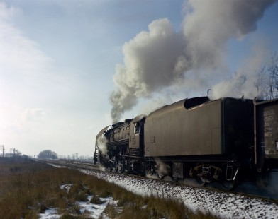 French National Railways steam locomotive no. 141-R 223 hauling a freight train south from Nevers at Sincaize-Meauce, Nièvre, France, on January 12, 1968. Photograph by Victor Hand, Hand-SNCF-C14-07