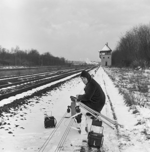 Mike Eagleson getting set up to take photographs at Sincaize-Meauce, Nièvre, France, on January 11, 1968. Photograph by Victor Hand, Hand-SNCF-14-132