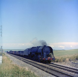 French National Railways steam locomotive no. 141-R685 hauling a freight train south at Wimereux, Pas-de-Calais, France, on July 5, 1963. Photograph by Victor Hand, Hand-SNCF-XC14-48