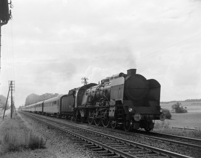French National Railways steam locomotive no. 231-K34 pulling passenger train running from Vintimille to Strasbourg at Belfort, Territoire de Belfort, France, on July 11, 1963. Photograph by Victor Hand, Hand-SNCF-02-0332