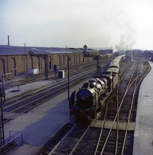 French National Railways steam locomotive no. 231-E23 leading train no. 27 running from Paris to Calais at Calais, Pas-de-Calais, France, on July 17, 1962. Photograph by Victor Hand, Hand-SNCF-XC14-36