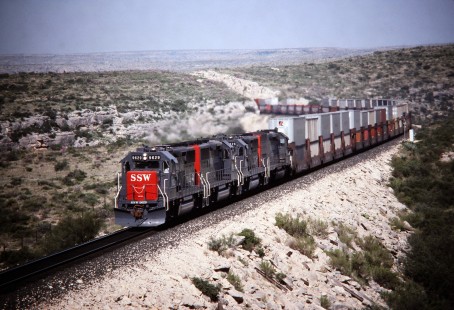 Eastbound Southern Pacific Railroad stack train climbs out of Sanderson (Texas) Canyon in October of 1988. Photograph by J. Parker Lamb. Lamb-03-029-18.JPG; © 2016, Center for Railroad Photography and Art