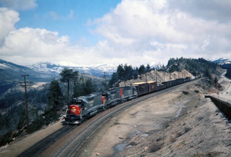 Eastbound Southern Pacific Railroad train heads through Eimgrant Gap on Donner Pass en route to Sacramento, California yard, in March of 1973. Photograph by J. Parker Lamb. Lamb-03-029-11.JPG; © 2016, Center for Railroad Photography and Art