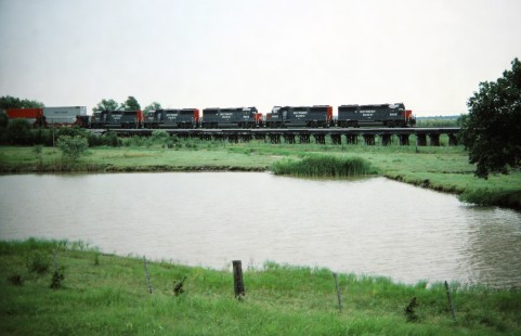 Eastbound Southern Pacific Railroad stack train departing Corsicana, Texas, in July of 1988. Photograph by J. Parker Lamb. Lamb-03-030-02.JPG; © 2016, Center for Railroad Photography and Art