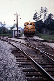 Eastbound Maine Central Railroad Company local crosses BM line at Berlin, New Hampshire in June of 1980 after getting high ball. Photograph by J. Parker Lamb. Lamb-03-037-18.JPG; © 2016, Center for Railroad Photography and Art