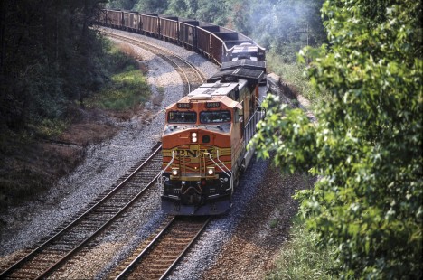 BNSF Railway locomotive no. 4080 approaches Jasper, Alabama, with empty hopper cars in May of 2006. Photograph by J. Parker Lamb. Lamb-03-036-19.JPG; © 2016, Center for Railroad Photography and Art